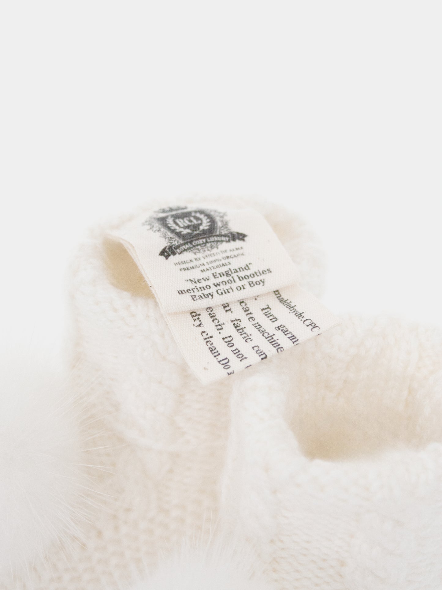 7.3 “New England” merino wool booties (White PomPoms)